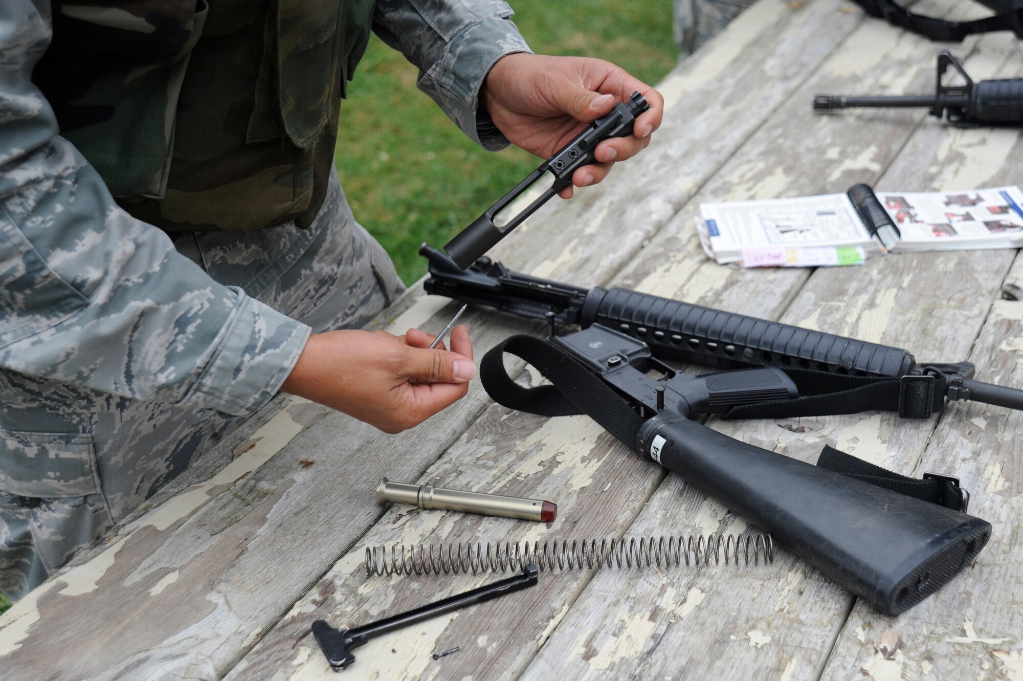 VANDENBERG AIR FORCE BASE, Calif. -- Senior Airman Austin Encina, 30th Civil Engineer Squadron member, practices assembling and disassembling an M-16 carbine rifle during deployment readiness training at Cocheo Park, Thursday, Nov. 1, 2012. Combat Arms Training and Maintenance is one of the essential elements on which Airmen are evaluated as they prepare for deployment. (U.S. Air Force photo/Michael Peterson)