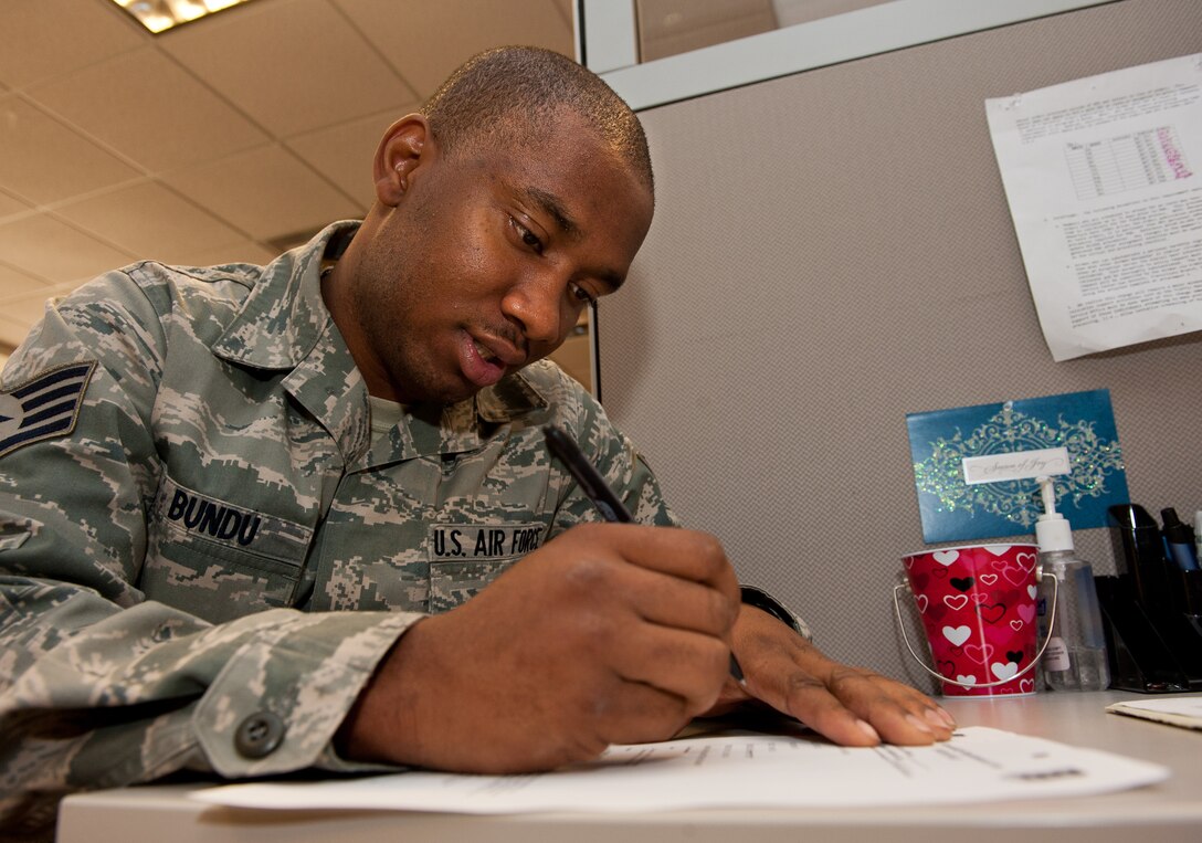 Staff Sgt. Rachid Bundu, 28th Force Support Squadron military personnel flight promotions specialist, verifies information on his new assignment paperwork in the Rushmore Center on Ellsworth Air Force Base, S.D., Oct. 30, 2012. Once Airmen receive assignment orders, they’re directed to the assignment office to begin outprocessing. (U.S. Air Force photo by Airmen 1st Class Kate Thornton-Maurer/Released) 