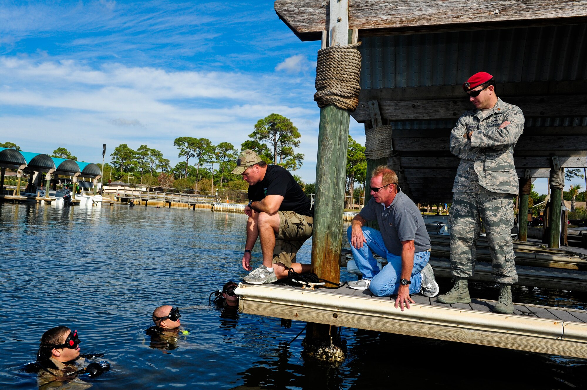 U.S. Air Force Senior Master Sgt. Robert Bartleson, a superintendent from Special Tactics Training Squadron, speaks with special tactics Airmen at the Soundside Marina on Hurlburt Field, Fla., Nov. 4, 2012. With the assistance and donated gear from the Hurlburt Field Dive Club, Airmen conducted a routine search and recovery dive sweeps of the waterways combining volunteer work with essential military training. (U.S. Air Force photo/Airman 1st Class Christopher Williams)
