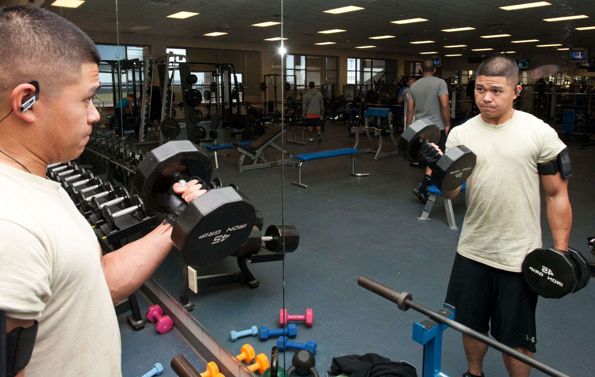 Senior Airman Patrick Cabusao, 22nd Maintenance Squadron Electronics and Environmental back-shop technician, performs bicep curls as part of his daily workout routine. As a maintenance technician, it is important to stay fit, and Cabusao stays in shape through regular exercise and a healthy diet. (U.S. Air Force photo/Airman 1st Class Victor J. Caputo)
