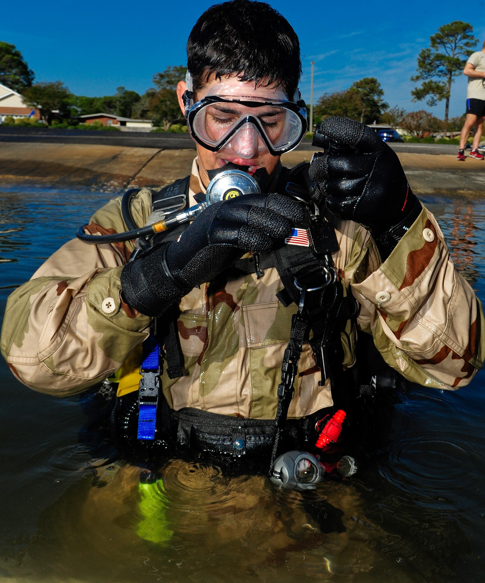 A U.S. Air Force special tactics Airmen from the Special Tactics Training Squadron, checks his gear before combat scuba diving training at the Soundside Marina on Hurlburt Field, Fla., Nov. 4, 2012. With the assistance and donated gear from the Hurlburt Field Dive Club, the Airmen conducted a routine search and recovery dive sweeps of the waterways combining volunteer work with essential military training. 
