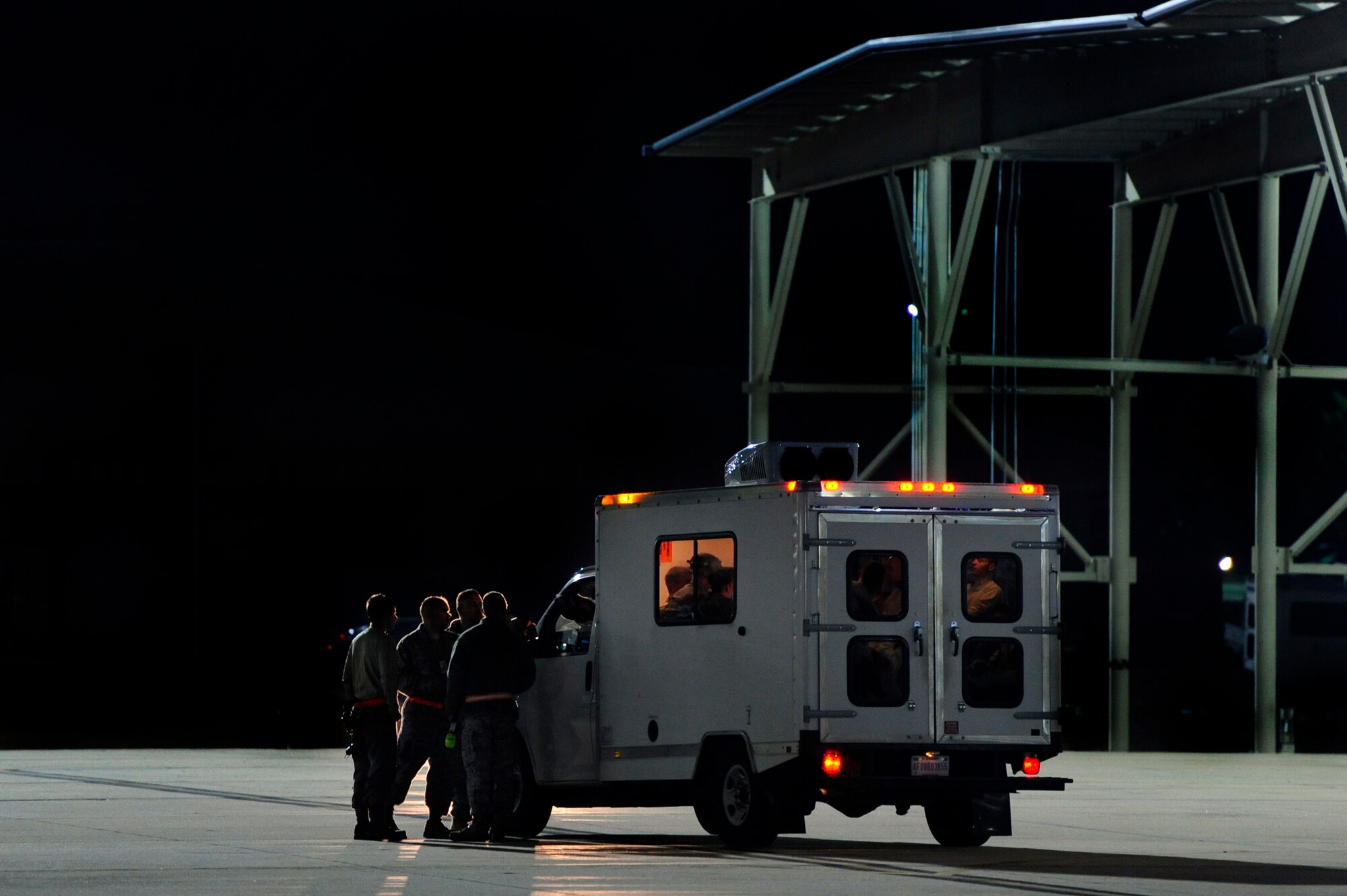 U.S. Air Force maintainers and crew chiefs assigned to the 20th Aircraft Maintenance Squadron gather discus flight line operations after launching several F-16 Fighting Falcons, Oct. 10, 2012, Shaw Air Force Base, S.C. Several Team Shaw Airmen and F-16 fighter pilots from the 77th Fighter Squadron deployed from Shaw to an undisclosed location in Southwest Asia. (U.S. Air Force photo by Staff Sgt. Kenny Holston/Released)