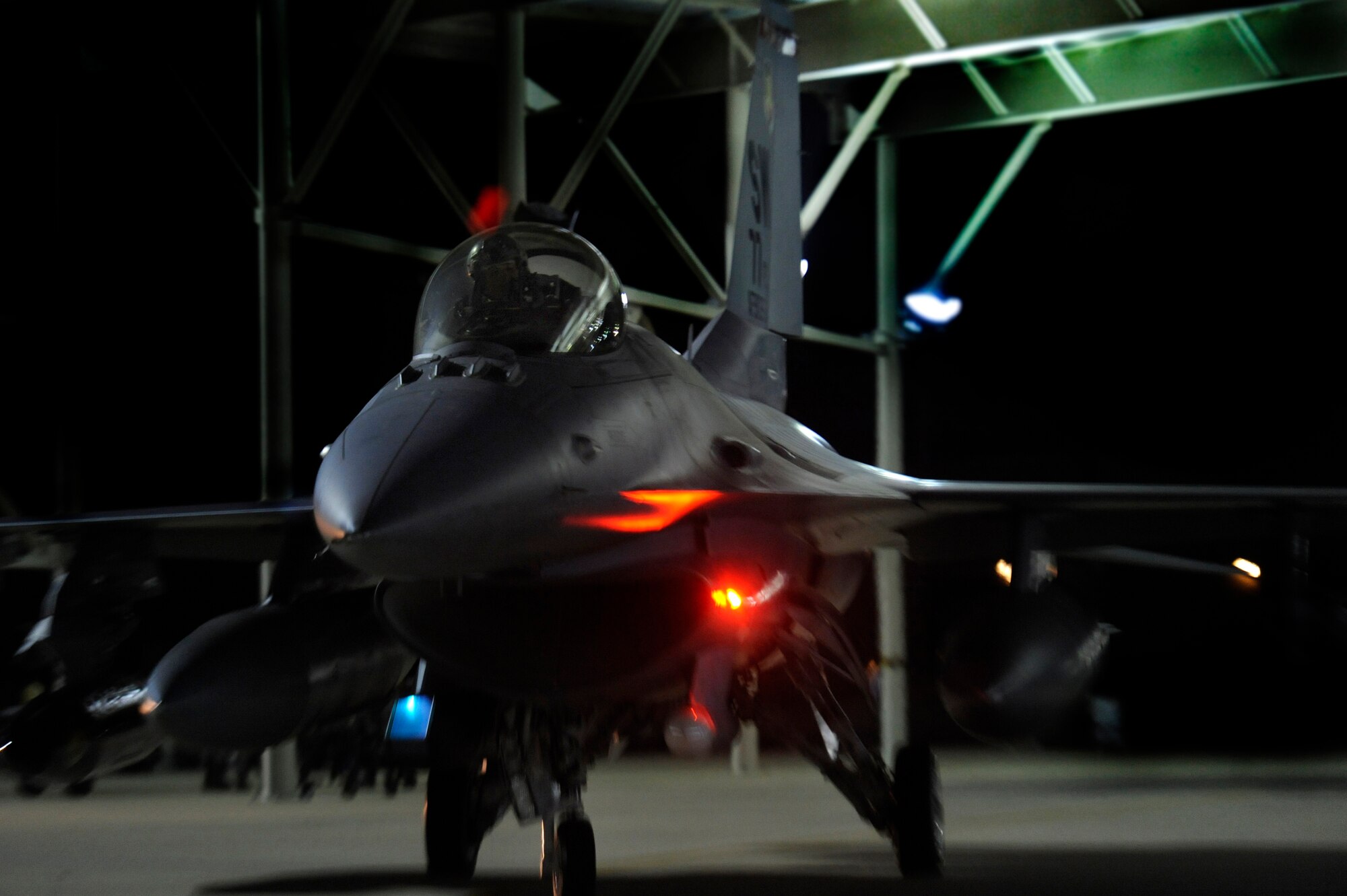 U.S. Air Force Lt. Col. Johnny Vargas, 77th Fighter Squadron commander is the first of many to taxi his F-16 Fighting Falcon from under the overhang during the generation of several F-16’s headed for a deployment in an undisclosed location in Southwest Asia, Oct. 10, 2012, Shaw Air Force Base, S.C. (U.S. Air Force photo by Staff Sgt. Kenny Holston/Released)