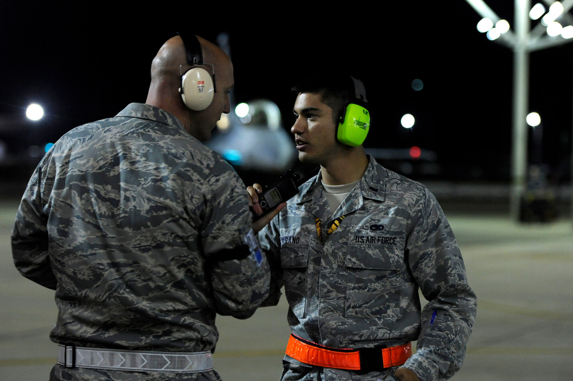U.S. Air Force 1st Lt. Alexander Pagano, 20th Aircraft Maintenance Squadron, (right) discussed flight line operations as several F-16 Fighting Falcons are prepped for take-off, Oct. 10, 2012, Shaw Air Force Base, S.C. Several Team Shaw Airmen and F-16 fighter pilots from the 77th Fighter Squadron deployed from Shaw to an undisclosed location in Southwest Asia. (U.S. Air Force photo by Staff Sgt. Kenny Holston/Released)