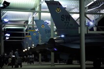 Several U.S. Air Force F-16 Fighting Falcons are lined up while being prepped and postured for take-off by 20th Aircraft Maintenance Squadron crew chiefs, Oct. 10, 2012, Shaw Air Force Base, S.C. Several Team Shaw Airmen and F-16 fighter pilots from the 77th Fighter Squadron deployed from Shaw to an undisclosed location in Southwest Asia. (U.S. Air Force photo by Staff Sgt. Kenny Holston/Released)