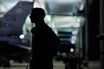 A U.S. Air Force crew chief assigned to the 20th Aircraft Maintenance Squadron looks on as he works with other crew chiefs to prep an F-16 Fighting Falcon for take-off, Oct. 10, 2012, Shaw Air Force Base, S.C. Several Team Shaw Airmen and F-16 fighter pilots from the 77th Fighter Squadron deployed from Shaw to an undisclosed location in Southwest Asia. (U.S. Air Force photo by Staff Sgt. Kenny Holston/Released)
