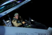 A U.S. Air Force fighter pilot assigned to the 77th Fighter Squadron gets situated in the cockpit of his F-16 Fighting Falcon before take-off, Oct. 10, 2012, Shaw Air Force Base, S.C. Several Team Shaw Airmen and F-16 fighter pilots from the 77th Fighter Squadron deployed from Shaw to an undisclosed location in Southwest Asia. (U.S. Air Force photo by Staff Sgt. Kenny Holston/Released)