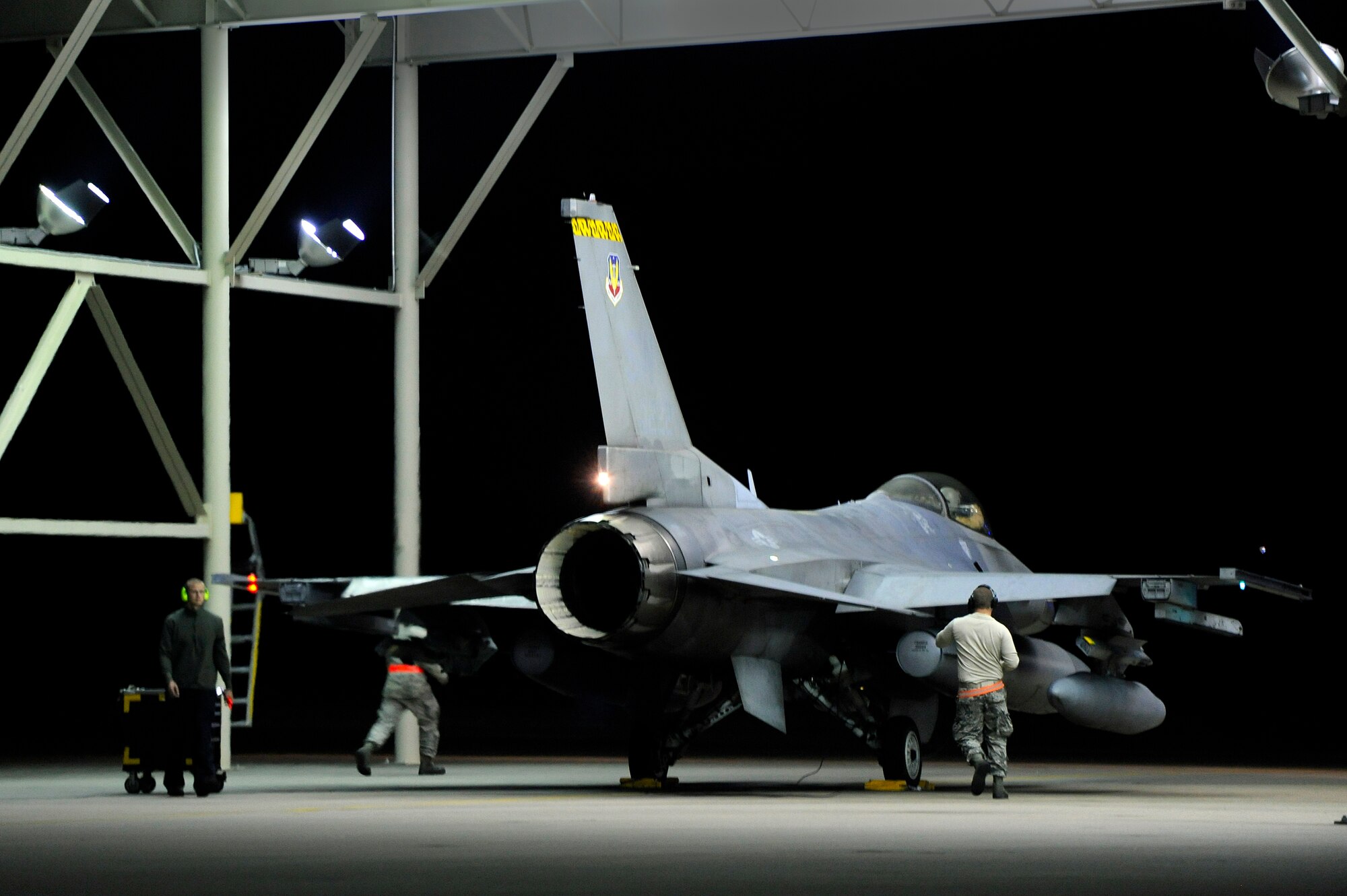 U.S. Air Force crew chiefs assigned to the 20th Aircraft Maintenance Squadron prep an F-16 Fighting Falcon for take-off Oct. 10, 2012, Shaw Air Force Base, S.C. Several Team Shaw Airmen and F-16 fighter pilots from the 77th Fighter Squadron deployed from Shaw to an undisclosed location in Southwest Asia. (U.S. Air Force photo by Staff Sgt. Kenny Holston/Released)