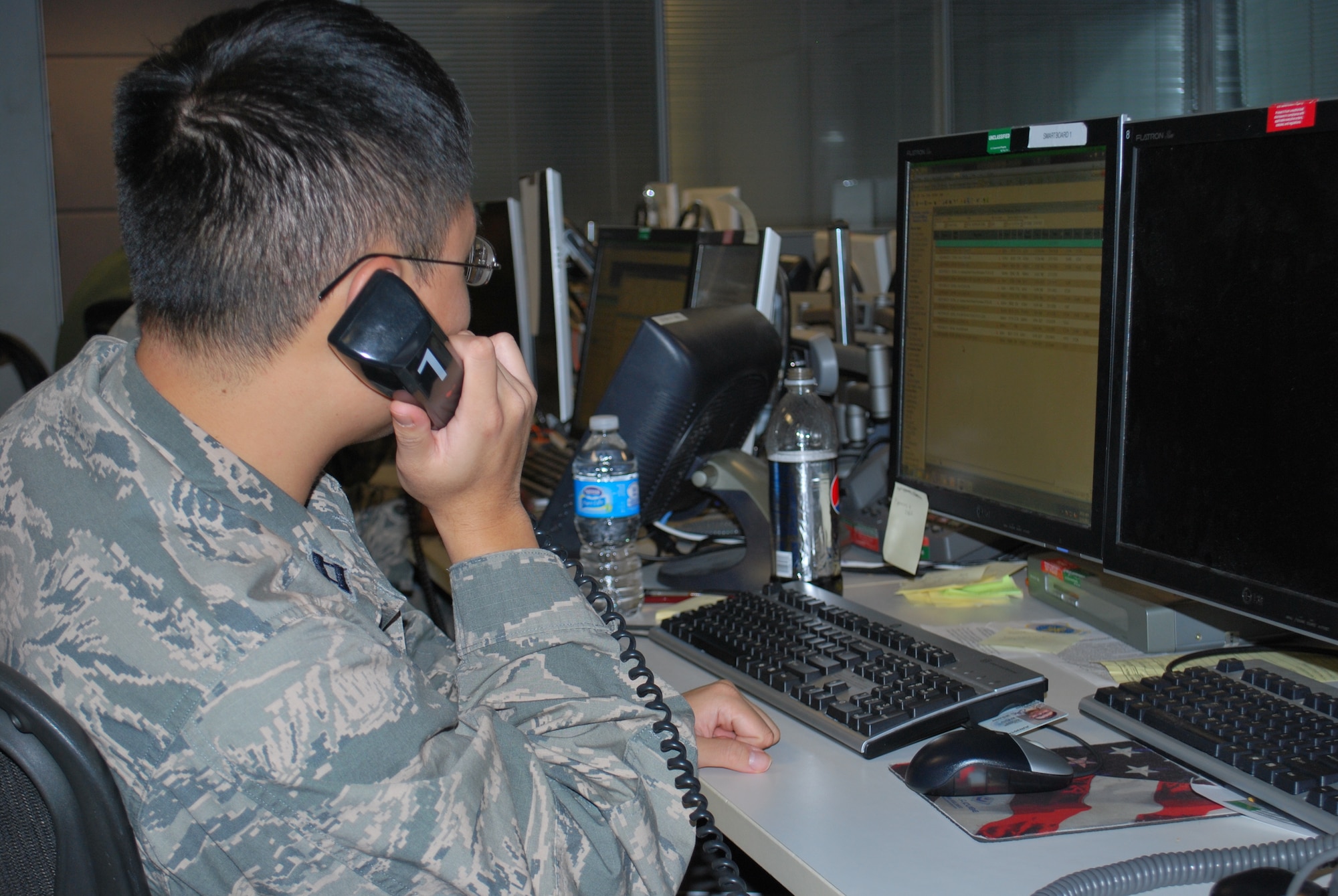 11/6/2012 - Capt. June Chung, assigned to the 618th Tanker Airlift Control Center at Scott Air Force Base, Ill., monitors the status of operations supporting relief efforts on the East Coast, from the 618th TACC's Contingency Response Cell, Nov. 6. 618th TACC personnel have been working around-the-clock to support relief efforts after Hurricane Sandy struck the region. The 618th TACC's Contingency Response Cell, comprised of mission planners, managers and command-and-control personnel, is specifically dedicated to Air Mobility Command's involvement in relief operations, enabling other 618th TACC personnel to continue planning missions to support other U.S. operations worldwide, including support of Operation Enduring Freedom. (U.S. Air Force photo/Capt. Mauri Slater)