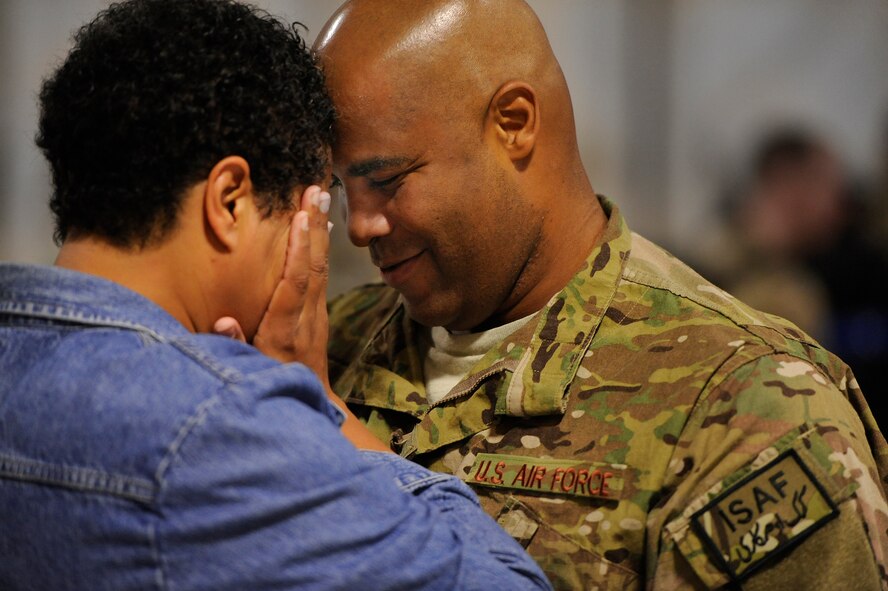 A U.S. Air Force senior noncommissioned officer assigned to the 20th Maintenance Group comforts his wife, explaining that everything will be fine just before leaving for a deployment, Oct. 10, 2012, Shaw Air Force Base, S.C. Several Team Shaw Airmen and F-16 fighter pilots from the 77th Fighter Squadron deployed from Shaw to an undisclosed location in Southwest Asia. (U.S. Air Force photo by Staff Sgt. Kenny Holston/Released) 