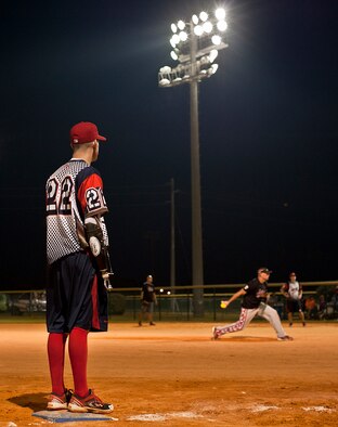 Nate Lindsey, a Wounded Warrior Amputee Softball Team player, watches the Northwest Florida Military Softball Team’s pitcher from third base during a softball game at the Morgan Sports Center in Destin, Fla., Nov. 3rd. WWAST, consisting of service members who lost limbs in battle, joined players from Eglin Air Force Base, Hurlburt Field and the Army 7th Special Forces Group, for a softball game in an effort to raise awareness of the sacrifices and resilience of military members. (U.S. Air Force photo/Randy Gon)