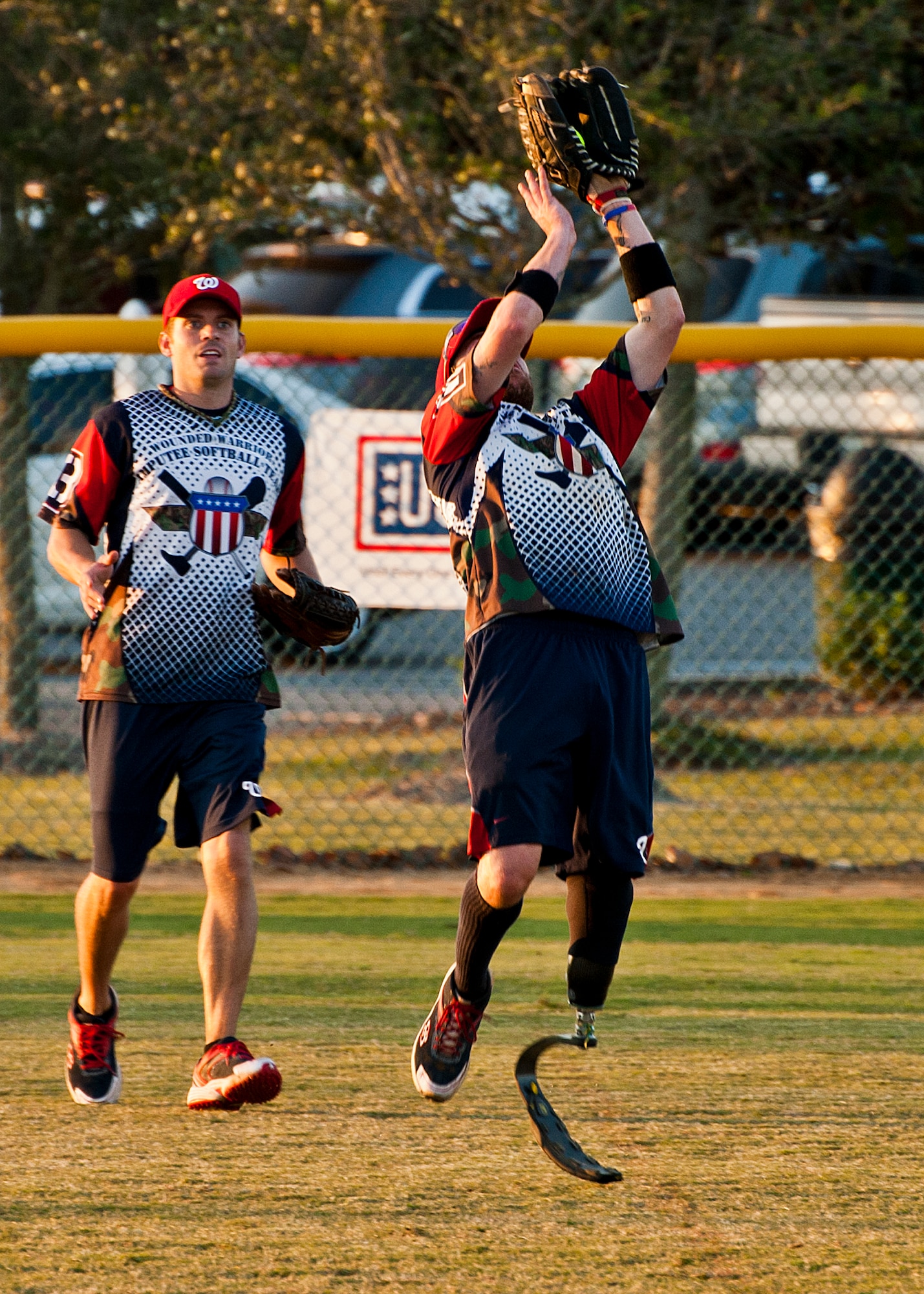 A Wounded Warrior Amputee Softball Team outfielder catches a fly ball at the Morgan Sports Center in Destin, Fla., Nov. 3rd. WWAST, consisting of service members who have lost limbs in battle, joined players from Eglin Air Force Base, Hurlburt Field and the Army 7th Special Forces Group, for a softball game in an effort to raise awareness of the sacrifices and resilience of military members. (U.S. Air Force photo/Randy Gon)
