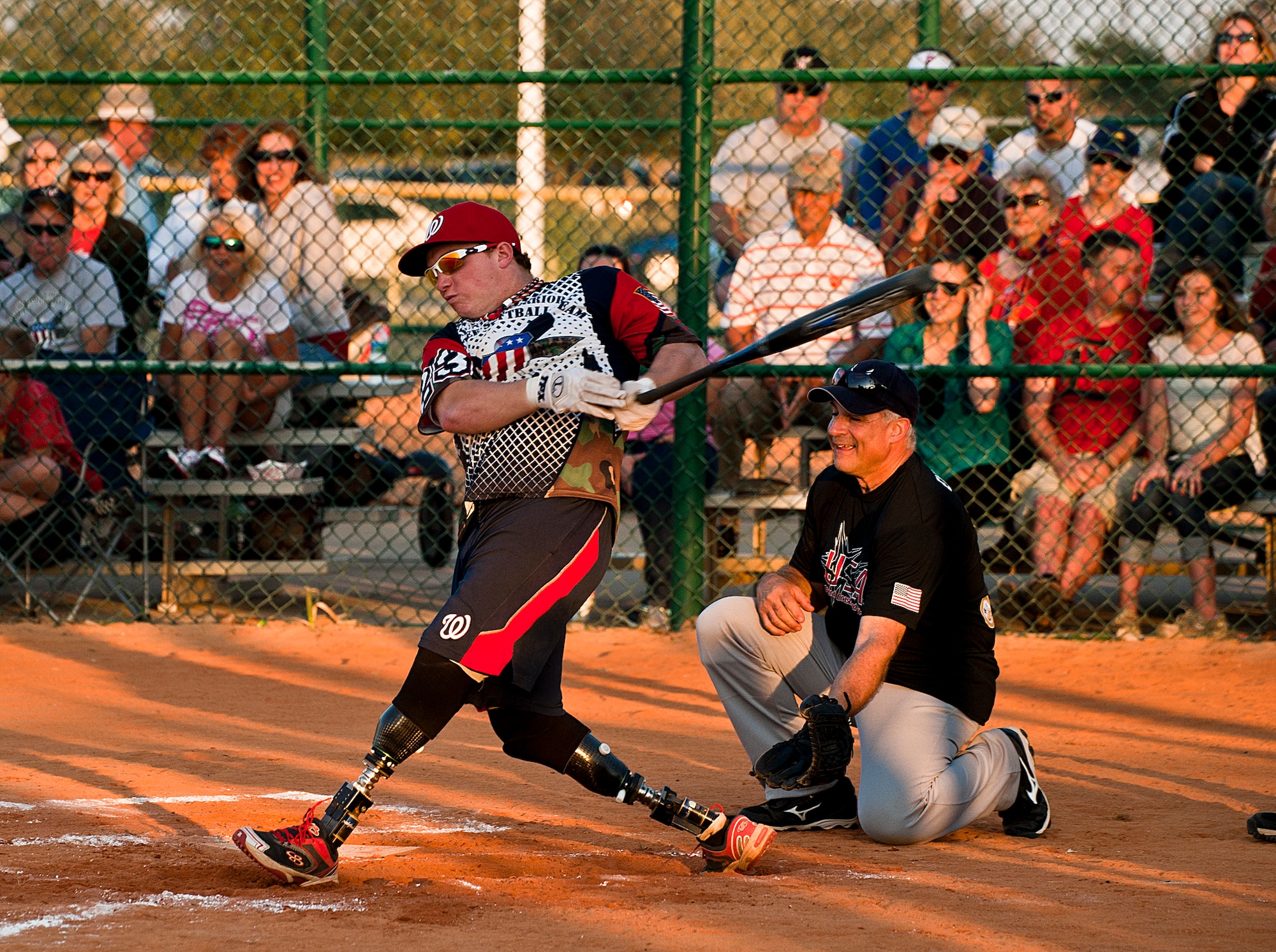 Josh Wege, a Wounded Warrior Amputee Softball Team player, pops a ball into the Northwest Florida Military Softball Team’s outfield at the Morgan Sports Center in Destin, Fla., Nov. 3rd. The two teams played to raise awareness of the sacrifices and resilience of military members. (U.S. Air Force photo/Randy Gon)