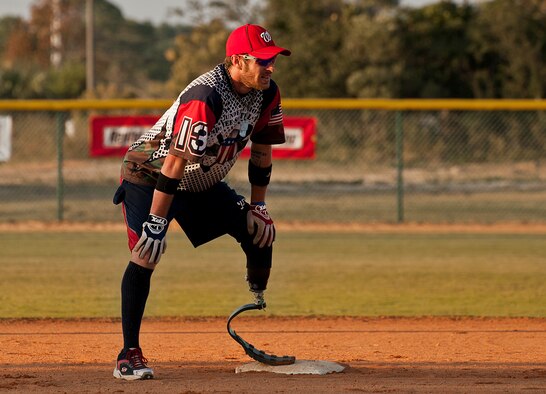 Nick Clark, a Wounded Warrior Amputee Softball Team player, waits at second base for the Northwest Florida Armed Services Softball Team pitch during a game at the Morgan Sports Center in Destin, Fla., Nov. 3rd. The two teams played to raise awareness of the sacrifices and resilience of military members. (U.S. Air Force/Randy Gon)