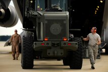 U.S. Air Force Airmen assigned to the 20th Logistics Readiness Squadron and C-17 crew chiefs load cargo on to a C-17 Globemaster III in support of an upcoming deployment, Oct. 5, 2012, Shaw Air Force Base, S.C. Several Team Shaw Airmen and F-16 fighter pilots from the 77th Fighter Squadron deployed from Shaw to an undisclosed location in Southwest Asia. (U.S. Air Force photo by Staff Sgt. Kenny Holston/Released)