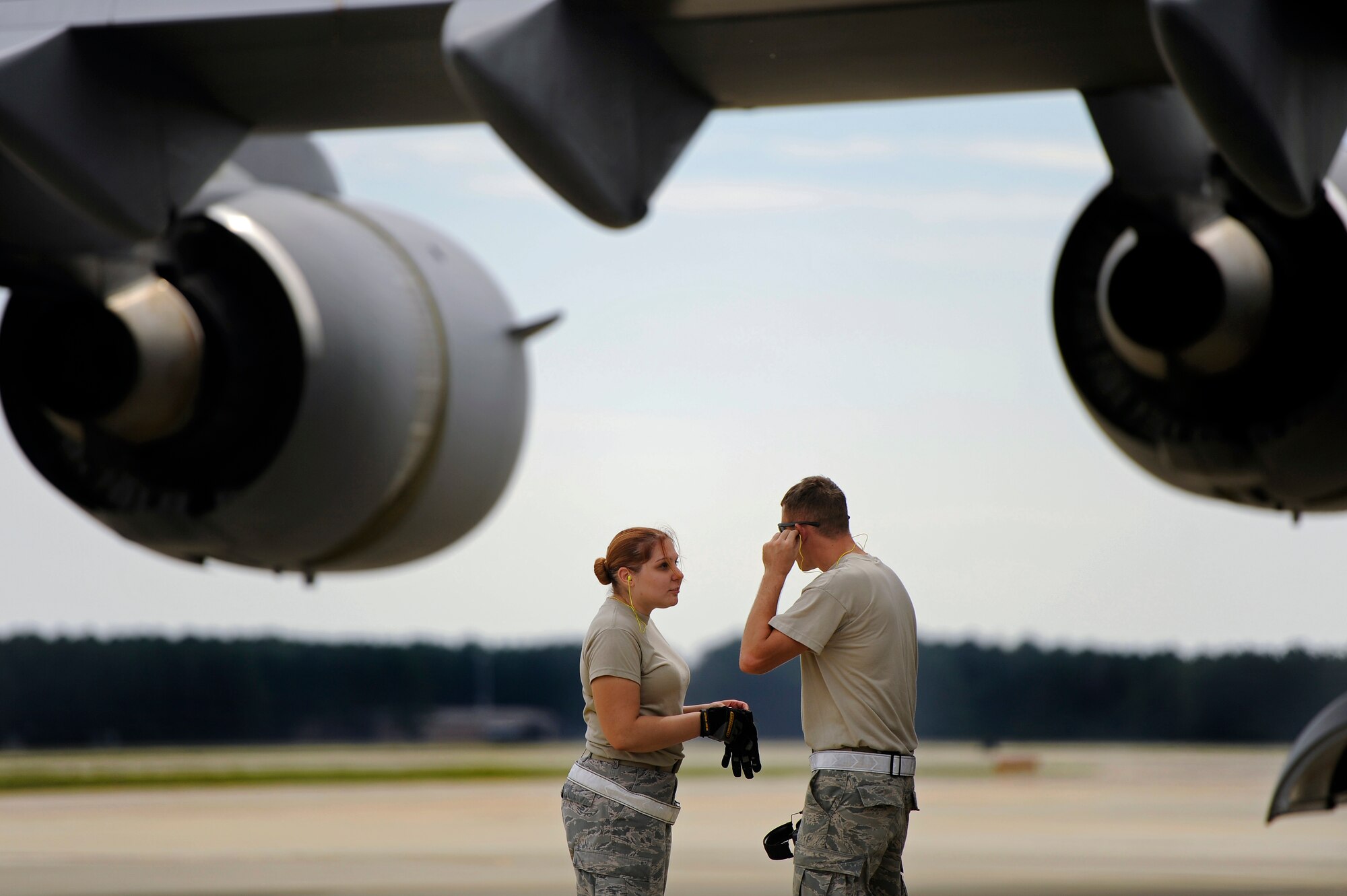 U.S. Air Force Airmen assigned to the 20th Logistics Readiness Squadron discuss their plan of action for loading Aerospace Ground Equipment and other cargo on to a C-17 Globemaster III in support of an upcoming deployment, Oct. 5, 2012, Shaw Air Force Base, S.C. Several Team Shaw Airmen and F-16 fighter pilots from the 77th Fighter Squadron deployed from Shaw to an undisclosed location in Southwest Asia. (U.S. Air Force photo by Staff Sgt. Kenny Holston/Released)