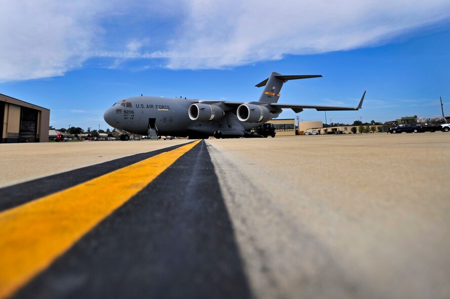 U.S. Air Force Airmen assigned to the 20th Logistics Readiness Squadron load Aerospace Ground Equipment on to a C-17 Globemaster III in support of an upcoming deployment, Oct. 5, 2012, Shaw Air Force Base, S.C. Several Team Shaw Airmen and F-16 fighter pilots from the 77th Fighter Squadron deployed from Shaw to an undisclosed location in Southwest Asia. (U.S. Air Force photo by Staff Sgt. Kenny Holston/Released)