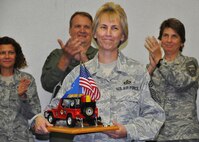 Newly promoted Chief Master Sgt. Darlene Peterson of the 711th Special Operations Squadron receives applause from her fellow chiefs during a ceremony officially inducting her into the Air Force’s highest enlisted rank Nov. 3 at Duke Field, Fla.   Following Air Force tradition, Peterson must not relinquish control of the toy Jeep memento she holds until the next new chief is likewise inducted.   (U.S. Air Force photo/Dan Neely)