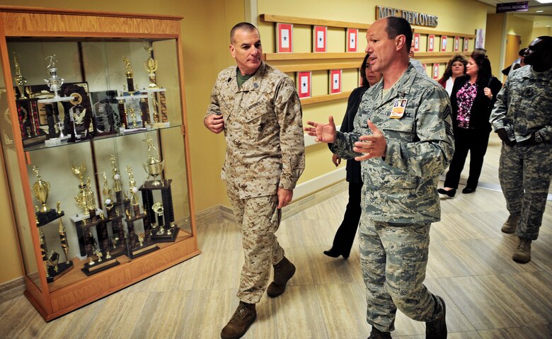 Sgt. Maj. Bryan Battaglia, Senior Enlisted Advisor to the Chairman Joint Chiefs of Staff, speaks to Chief Master Sgt. David Marchant, 375th Medical Group chief, about their deployed servicemembers  during a tour of Scott Air Force Base Oct. 30, 2012. Battaglia serves as the principal advisor to the Chairman and Secretary of Defense on all matters involving joint and combined total force integration, utilization, health of the force and joint development for enlisted personnel. (U.S. Air Force photo/ Staff Sgt. Ryan Crane)