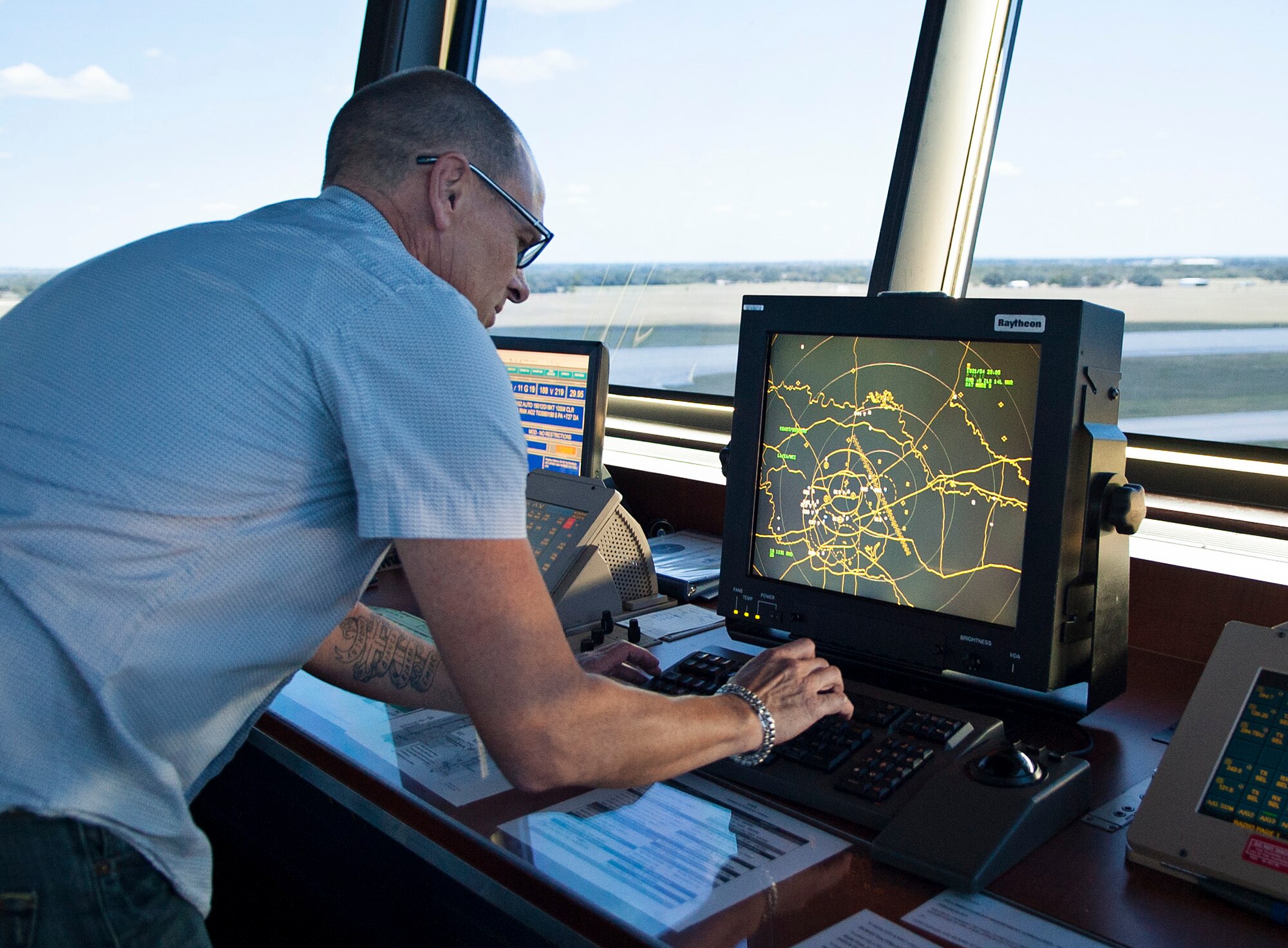 Andrew Lisius, 12th Operations Support Squadron air traffic controller, watches in-and outbound aircraft from his radar screen at the east tower Aug. 14 at Joint Base San Antonio-Randolph. (U.S. Air Force photo by Benjamin Faske)