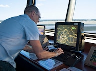 Andrew Lisius, 12th Operations Support Squadron air traffic controller, watches in-and outbound aircraft from his radar screen at the east tower Aug. 14 at Joint Base San Antonio-Randolph. (U.S. Air Force photo by Benjamin Faske)