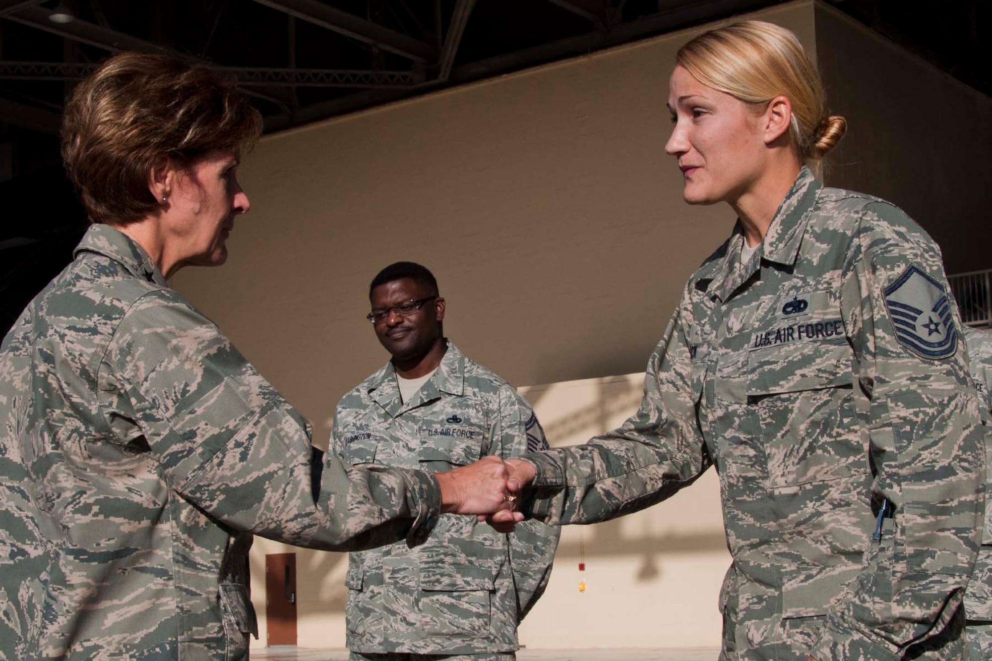 U.S. Air Force Master Sgt. Karen Mack, a 307th Aircraft Maintenance Squadron mechanic, greets Lt. Gen. Judith Fedder, Deputy Chief of Staff for Logistics, Installations & Mission Support at Barksdale Air Force Base, La., Nov. 3, 2012.  During her tour of the 307 AMXS hangar, Fedder congratulated all members of the unit on a job well done.  Fedder also presented Mack with a coin for outstanding leadership and effort with the 307 AMXS. (U.S. Air Force photo by Staff Sgt. Ted Daigle/Released)