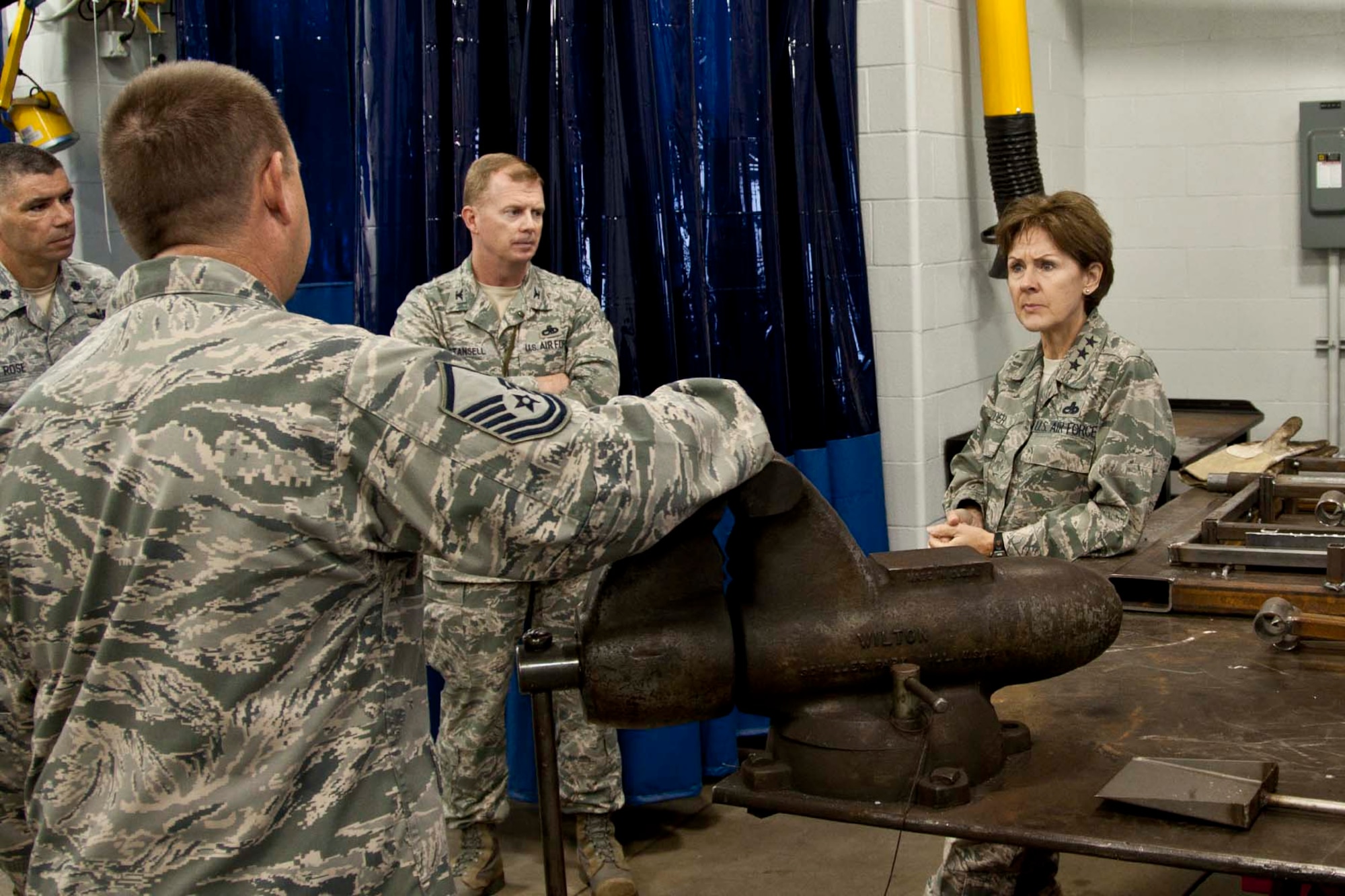 U.S. Air Force Lt. Gen. Judith Fedder, Deputy Chief of Staff for Logistics, Installations & Mission Support, listens intently during a discussion with members of the 307th Maintenance Support Squadron at Barksdale Air Force Base, La., Nov. 3, 2012.  Fedder took a look at the 307 MXS Metals Technology Shop to gain first-hand knowledge of how Total Force Integration was being applied at Barksdale.  (U.S. Air Force photo by Staff Sgt. Ted Daigle/Released)