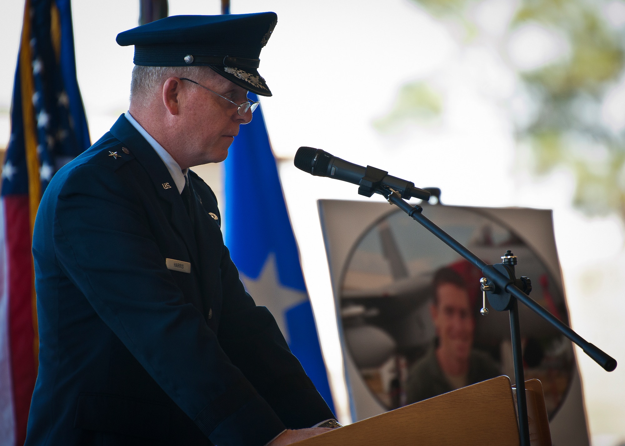 Brig. Gen. David Harris, the 96th Test Wing commander, speaks to the crowd during the memorial ceremony for their friend, Maj. Garrett Knowlan, the 96th Test Wing executive officer, Nov. 5 at Eglin Air Force Base, Fla.  Knowlan died while participating in Air Force Survival, Evasion, Resistance and Escape training at the Naval Air Station in Pensacola.  The memorial service brought family, friends and co-workers together to say their final goodbyes.  (U.S. Air Force photo/Samuel King Jr.)