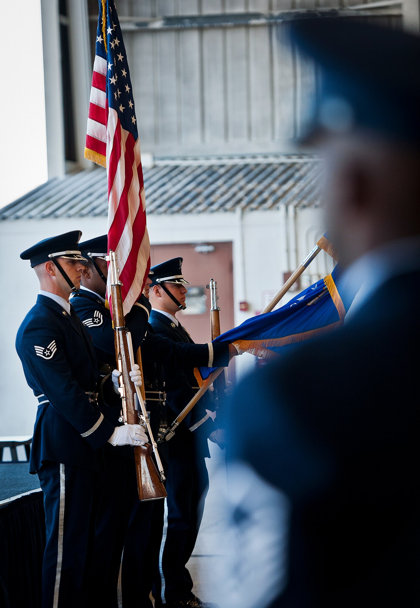The Eglin honor guard presents the colors during a memorial ceremony for Maj. Garrett Knowlan, the 96th Test Wing executive officer, Nov. 5.  Knowlan died while participating in Air Force Survival, Evasion, Resistance and Escape training at the Naval Air Station in Pensacola.  The memorial service brought family, friends and co-workers together to say their final goodbyes.  (U.S. Air Force photo/Samuel King Jr.)