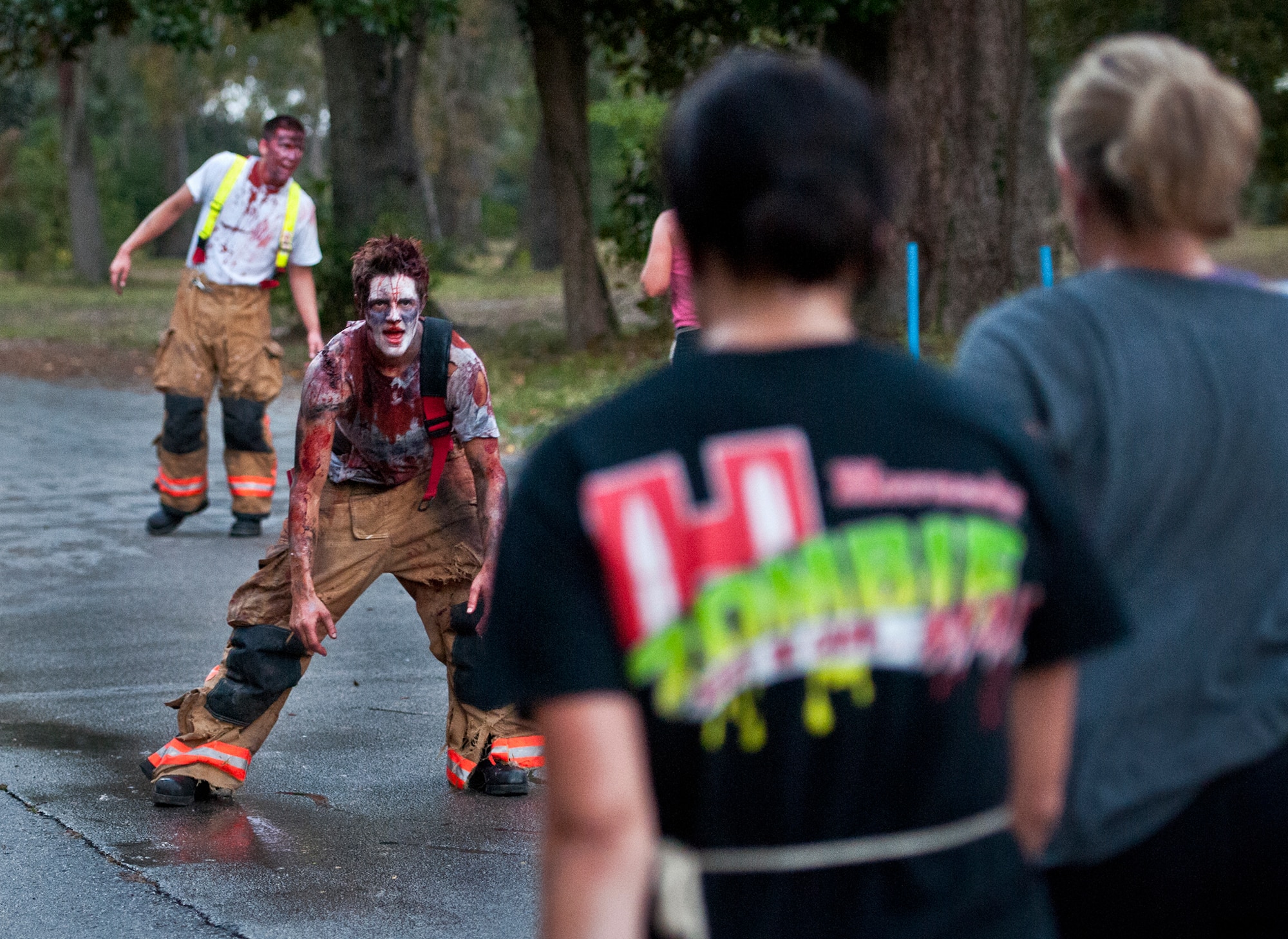 Zombie Amber moves toward her next “victim” at the first-ever Zombie Stomp run at Eglin Air Force Base, Fla., Nov. 3.  More than 425 fearless runners braved zombie-infested woods, water and mud hazards and other obstacles over a 4.5 mile course.  (U.S. Air Force photo/Samuel King Jr.)