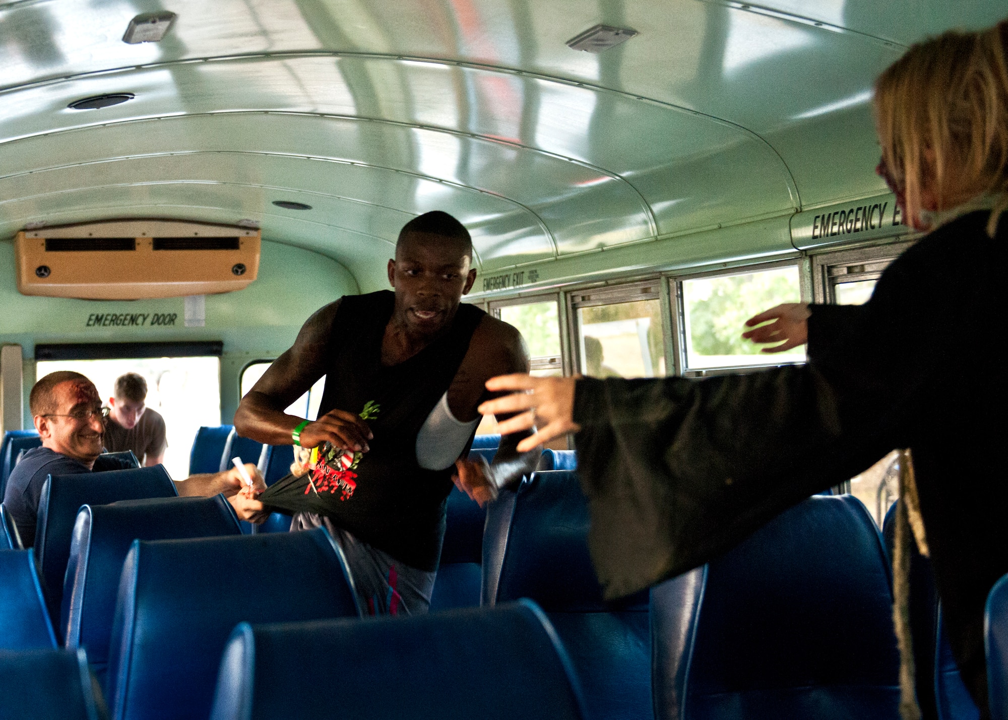 A runner tries to escape a bus of the undead at the first-ever Zombie Stomp run at Eglin Air Force Base, Fla., Nov. 3.  More than 425 fearless runners braved zombie-infested woods, water and mud hazards and other obstacles over a 4.5 mile course.  (U.S. Air Force photo/Samuel King Jr.)