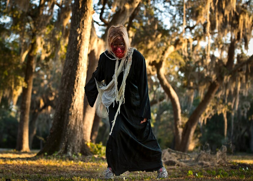 Zombie Ashley stumbles toward her next victim at the first-ever Zombie Stomp run at Eglin Air Force Base, Fla., Nov. 3.  More than 425 fearless runners braved zombie-infested woods, water and mud hazards and other obstacles over a 4.5 mile course.  (U.S. Air Force photo/Samuel King Jr.)