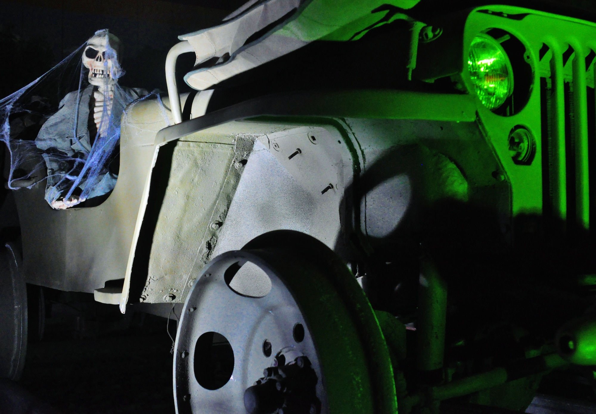 A skeleton commandeers a jeep converted for railway use in an exhibit at the U.S. Army Transportation Museum's "Night at the Transportation Museum" event at Fort Eustis, Va., Oct. 31, 2012. Despite a late postponement due to the impact of Hurricane Sandy on the region, the museum welcomed a record high 811 guests to the event, now it its third year. (U.S. Air Force photo by Senior Airman Jason J.
Brown/Released)
