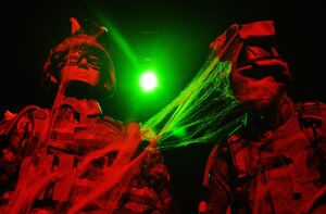 Two mannequins of Soldiers stand wrapped in cobwebs and bathed in eerie light at the U.S. Army Transportation Museum's "Night at the Transportation Museum" event at Fort Eustis, Va., Oct. 31, 2012. The three-hour event treated more than 800 guests to a haunted house-style tour of the museum, complete with costume-clad volunteers handing out candy to young trick-0f-treaters. (U.S. Air Force photo by Senior Airman Jason J. Brown/Released)