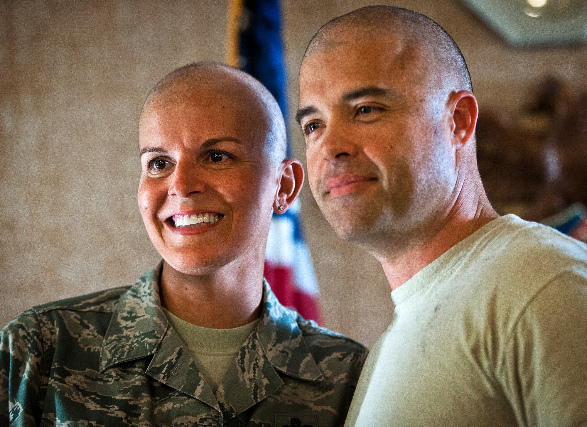 Master Sgt.s Catherine Holland and William Murphy of the 96th Fuels Management Flight, stand together after Murphy’s new haircut during a Combined Federal Campaign fundraising event Nov. 2 at Eglin Air Force Base, Fla.  The event was in support of Holland, who had a double mastectomy in August and is currently undergoing chemotherapy treatment.  The fundraiser to see who would get their head shaved by Holland raised $722 dollars for the Susan G. Komen Foundation.  Murphy and three others received the most donations/votes to see them get their head shaved.  (U.S. Air Force photo/Samuel King Jr.)