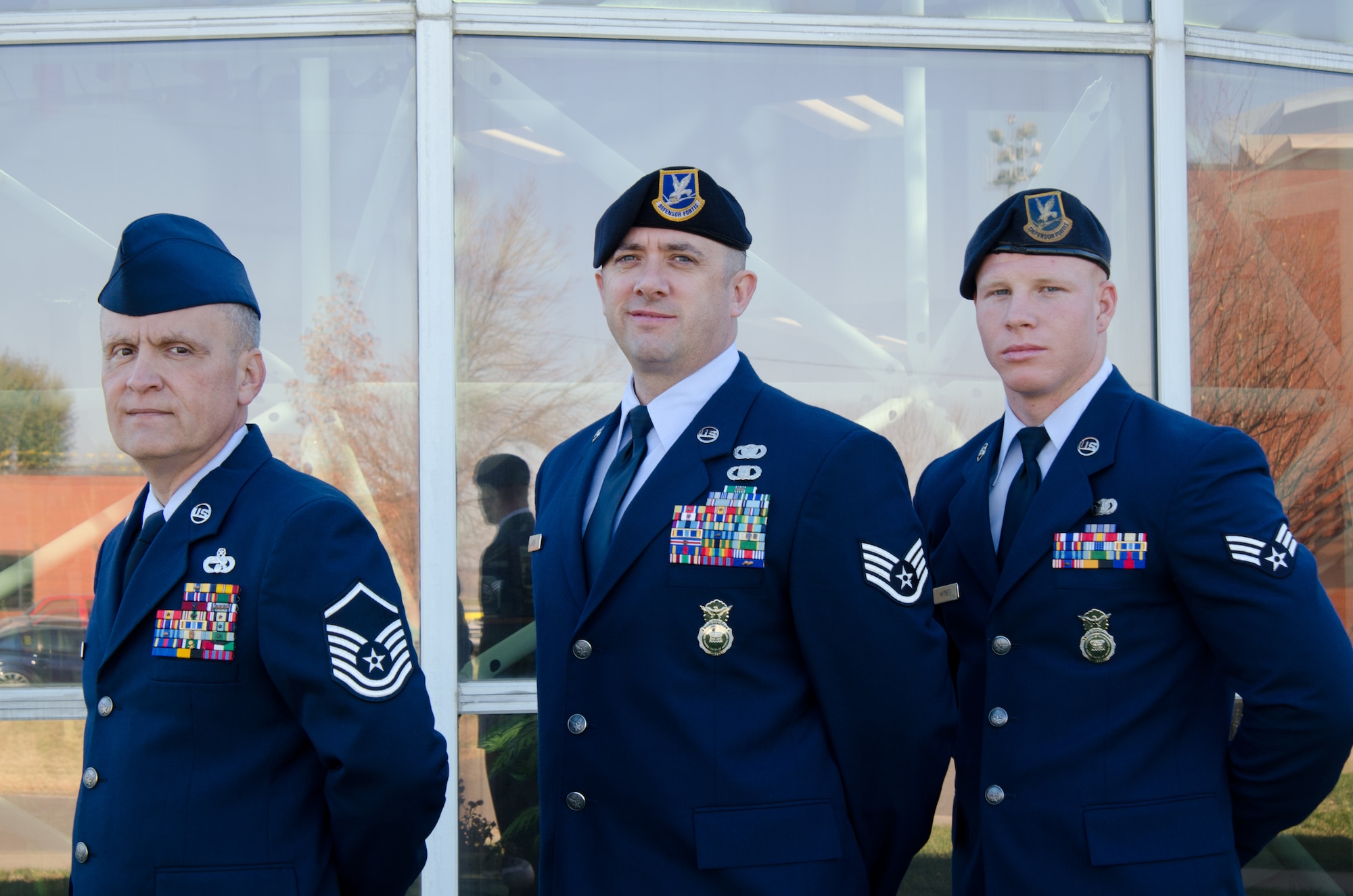The Missouri Air National Guard, 139th Airlift Wing Outstanding Airmen of the Year, from left, Master Sgt. Thomas Triplett, Staff Sgt. Troy Green and Senior Airman Gregory Haynes, are recognised for their accomplishments Nov. 3 at Rosecrans Air National Guard Base, St Joseph, Mo. (U.S. Air Force photo/Senior Airman Kelsey Ramirez) (Released)