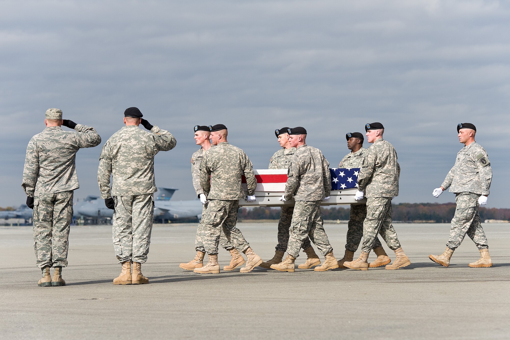 A U.S. Army carry team transfers the remains of Army Spc. Ryan P. Jayne, of Campbell, N.Y., at Dover Air Force Base, Del., Nov. 6, 2012. Jayne was assigned to the 178th Engineer Battalion, 412th Theater Engineer Command, Oswego, N.Y. (U.S. Air Force photo/Roland Balik)