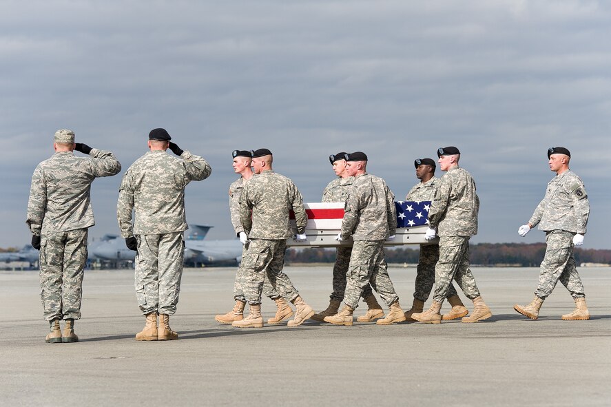 A U.S. Army carry team transfers the remains of Army Spc. Ryan P. Jayne, of Corning, N.Y., at Dover Air Force Base, Del., Nov. 6, 2012. Jayne was assigned to the 178th Engineer Battalion, 412th Theater Engineer Command, Oswego, N.Y. (U.S. Air Force photo/Roland Balik) 
