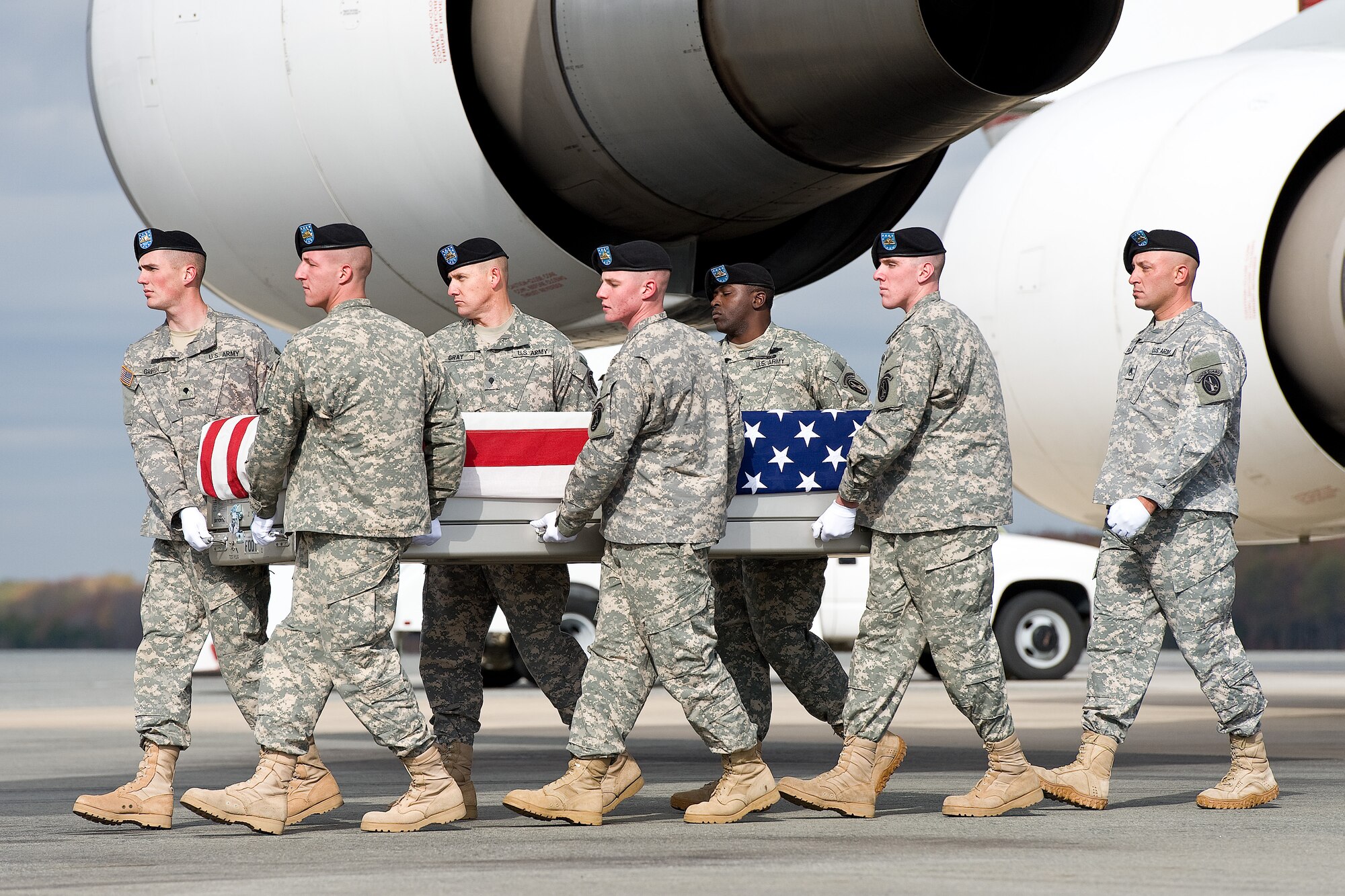 A U.S. Army carry team transfers the remains of Army Spc. Brett E. Gornewicz, of Alden, N.Y., at Dover Air Force Base, Del., Nov. 6, 2012. Gornewicz was assigned to the 178th Engineer Battalion, 412th Theater Engineer Command, Oswego, N.Y. (U.S. Air Force photo/Roland Balik)