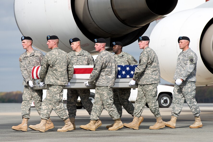 A U.S. Army carry team transfers the remains of Army Spc. Brett E. Gornewicz, of Alden, N.Y., at Dover Air Force Base, Del., Nov. 6, 2012. Gornewicz was assigned to the 178th Engineer Battalion, 412th Theater Engineer Command, Oswego, N.Y. (U.S. Air Force photo/Roland Balik)