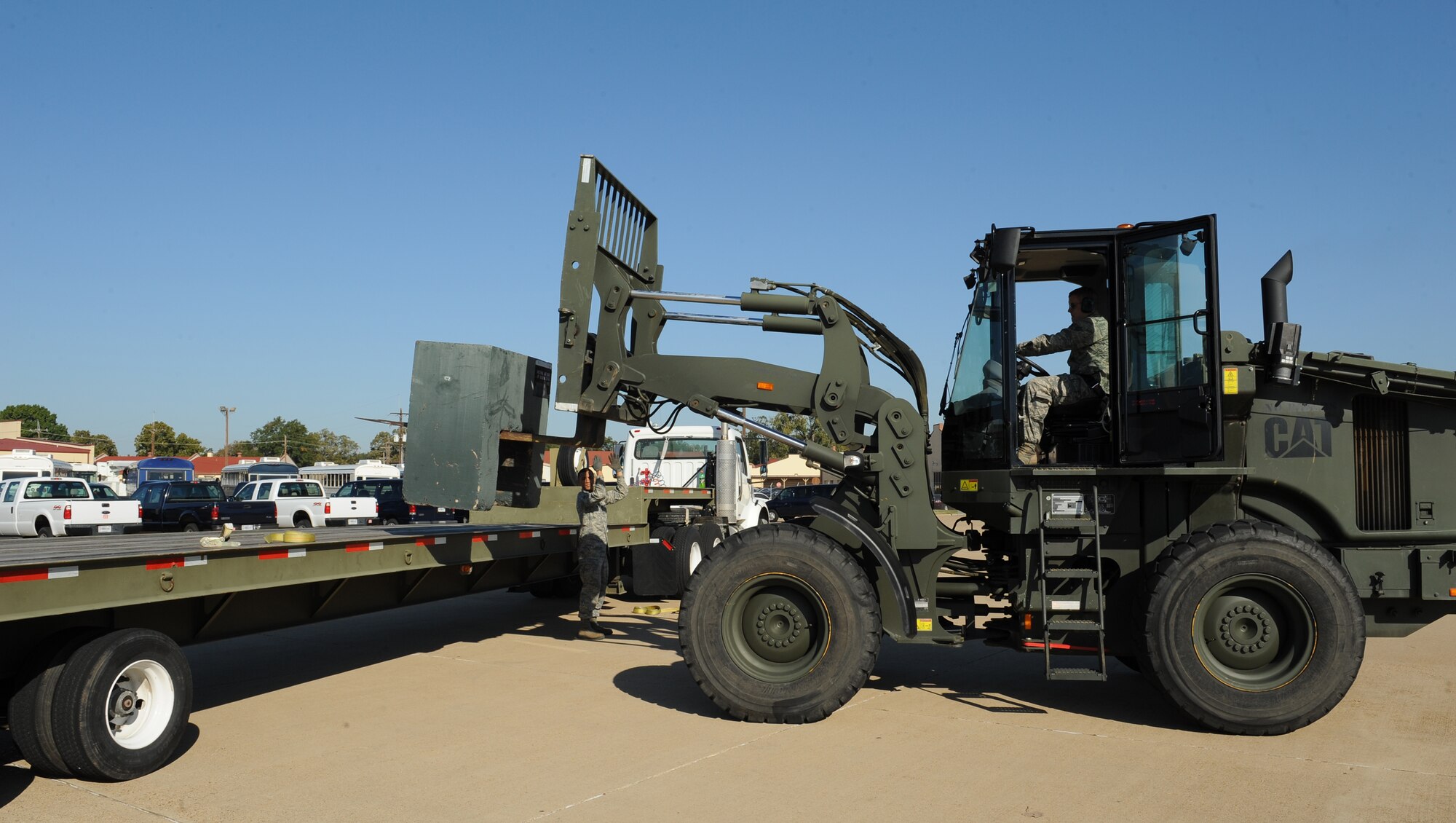 Senior Airman Cody Fleeger, 2nd Logistics Readiness Squadron Vehicle Operations journeyman, operates a forklift to place a training block onto a 45 foot trailer during a training scenario on Barksdale Air Force Base, La., Oct. 31. Vehicle operators support the Barksdale mission by driving aircrew to and from their aircraft as well as delivering parts to maintainers on the flightline. (U.S. Air Force photo/Airman 1st Class Benjamin Gonsier)(RELEASED)