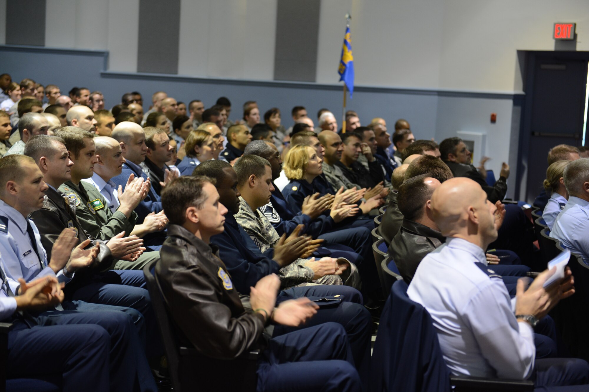 Airmen from the 62nd Airlift Wing and 627th Air Base Group applaud as the Air Mobility Command Inspector General team announce exceptional performers during an Operational Readiness Inspection outbrief Nov. 5, 2012 at Joint Base Lewis-McChord, Wash. The team earned an overall grade of satisfactory during the inspection that took place Oct. 13 to 20 at the Volk Field Combat Readiness Training Center, Wis. (U.S. Air Force photo/Master Sgt. Todd Wivell)