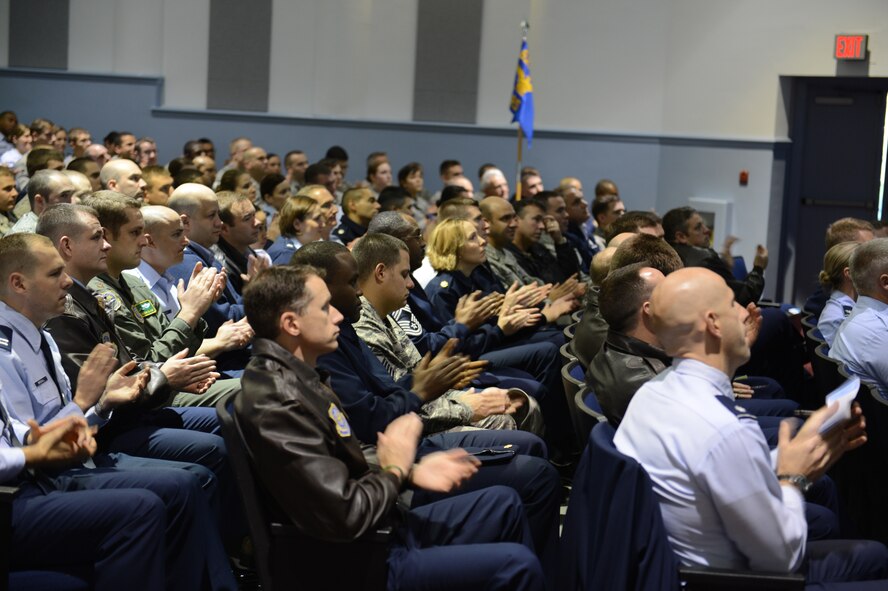 Airmen from the 62nd Airlift Wing and 627th Air Base Group applaud as the Air Mobility Command Inspector General team announce exceptional performers during an Operational Readiness Inspection outbrief Nov. 5, 2012 at Joint Base Lewis-McChord, Wash. The team earned an overall grade of satisfactory during the inspection that took place Oct. 13 to 20 at the Volk Field Combat Readiness Training Center, Wis. (U.S. Air Force photo/Master Sgt. Todd Wivell)