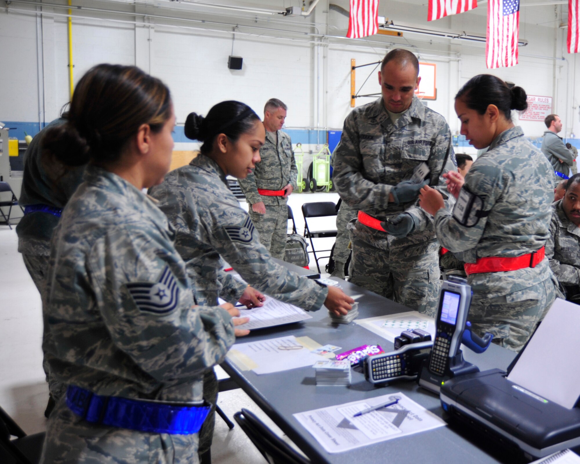 Airmen receive their accountability numbers upon arrival during the 2012 Operational Readiness Inspection Oct. 15, 2012, at Volk Field Combat Readiness Training Center, Wis. Airmen from the 62nd and 446th Airlift Wings and the 627th Air Base Group teamed up to demonstrate their ability to conduct its wartime mission. (U.S. Air Force photo/Staff Sgt. Frances Kriss)