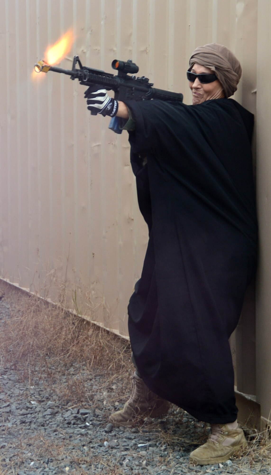 A member of the Oppositional Forces fires her weapon during a field training exercise Oct. 25, 2012, at Joint Base McGuire-Dix-Lakehurst, NJ. Members of the 436th Aerial Port Squadron at Dover Air Force Base, Del., were participating in the Combat Airman Skills Training course which helps to prepare Airmen for deployment. (U.S. Air Force photo by Tech. Sgt. Chuck Walker)