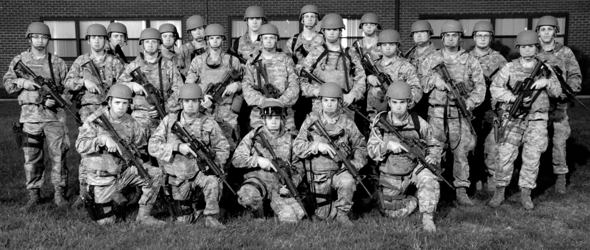 Members of the 436th Aerial Port Squadron form up before the beginning of their Field Training Exercise Oct. 25, 2012, at Joint Base McGuire-Dix-Lakehurst, NJ. The Team Dover members were participating in the Combat Airman Skills Training course which prepares Airmen for deployment. (U.S. Air Force photo by Tech. Sgt. Chuck Walker)