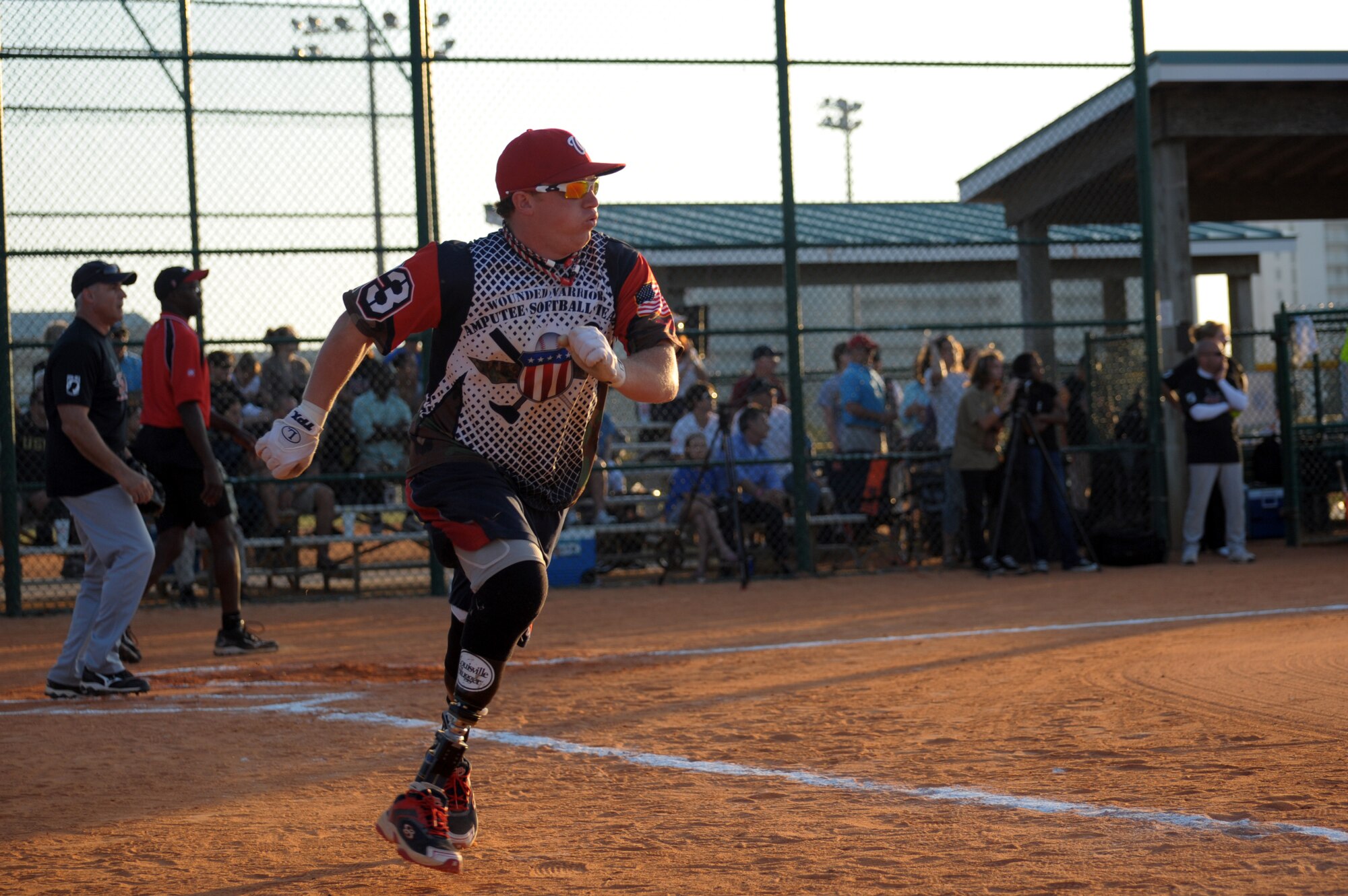 Joshua Wege, Wounded Warrior Amputee softball team member, runs to first base during a game at the Morgan Sports Complex in Destin, Fla., Nov. 3, 2012.The team challenged Hurlburt team members of the Northwest Florida Armed Services softball team and was met with a loss. (U.S. Air Force photo/Senior Airman Eboni Reams)

