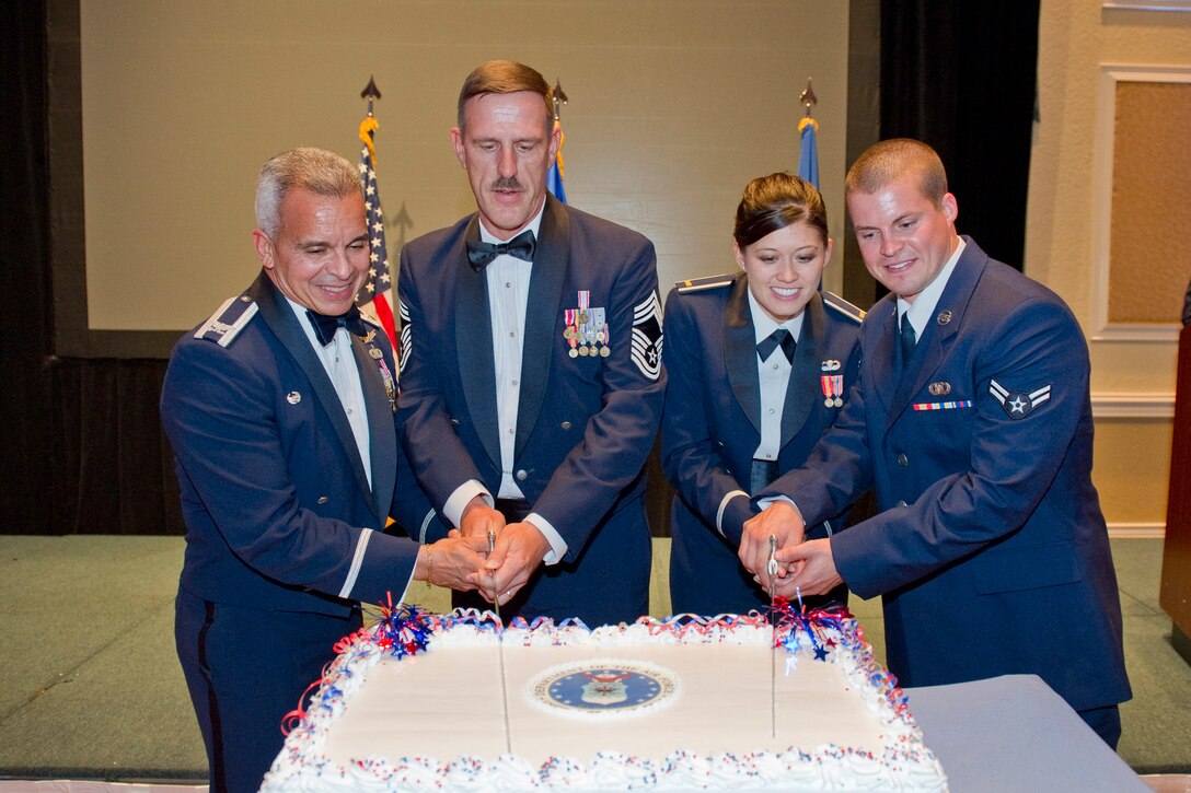 Tradition is served. The oldest and youngest enlisted Airmen and officers
took part in the traditional cake cutting ceremony. Doing the honors are
(left to right), Col. Ed Rivera, 45th Space Wing Safety Chief, Chief Master
Sgt. John Nederhoed, AFTAC Command Chief, 2nd Lt. Alicia Wallace, 45th Space
Wing Public Affairs and Airman 1st Class Christopher Petrosky, 45th
Operations Support Squadron.
