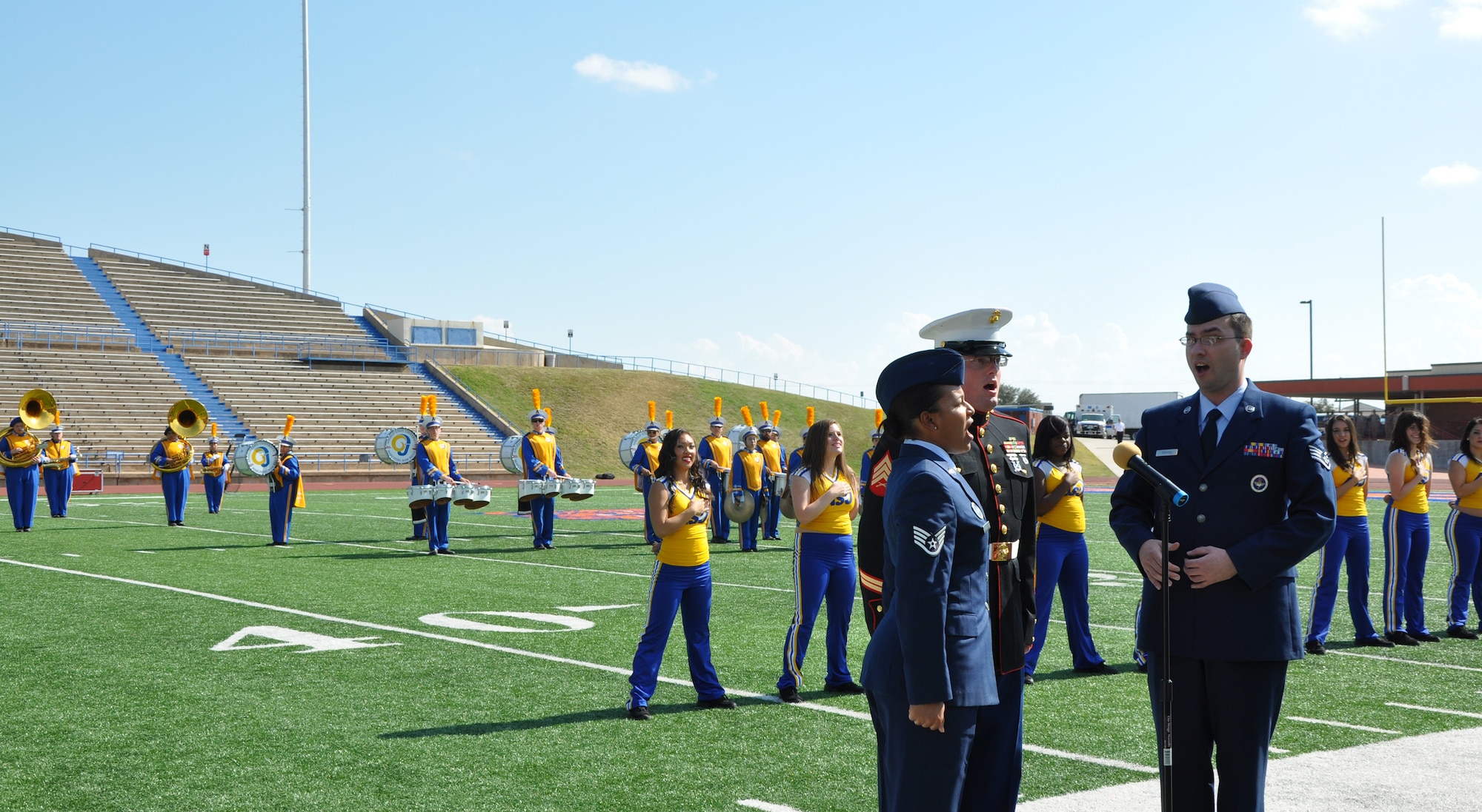 SAN ANGELO, Texas—Patriotic Blue, Goodfellow Air Force Base’s military singing group, performs the National Anthem at the Le Grande Stadium during the opening ceremonies of Angelo State University’s Military Appreciation Night Nov. 3. Service members and their families received free admission to the annual event. (U.S. Air Force photo/Airman 1st Class Jessica Keith)