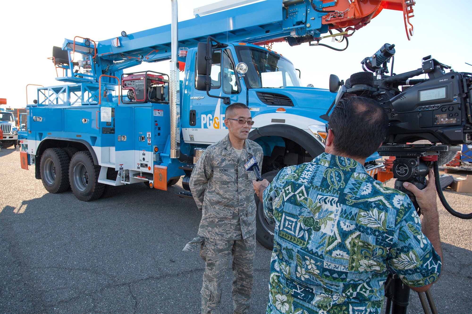 Col. Glenn Young, Air Forces Northern Emergency Preparedness Liaison Officer, explains in a television news interview Nov. 4, 2012, how Pacific Gas & Electric power-line repair trucks and U.S. Coast Guard water pumps will be airlifted from Travis Air Force Base, Calif., to aid in the Hurricane Sandy recovery. The equipment was flown to New York's John F. Kennedy Airport on board Air Mobility Command C-5 Galaxy and C-17 Globemaster III transports.  The effort is part of the U.S. Northern Command-led endeavor to support Federal Emergency Management Agency's storm response work. Air Force EPLOs, such as Colonel Young, are senior Air Force Reserve officers who are subject matter experts in state and regional disaster response plans, advising civil authorities how Air Force capabilities can support disaster response.  (U.S. Air Force photo / Lt. Col. Robert Couse-Baker)
